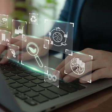 Computer keyboard with  data and technology images surrounding it.