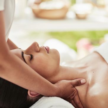 Woman receiving a relaxing neck massage.