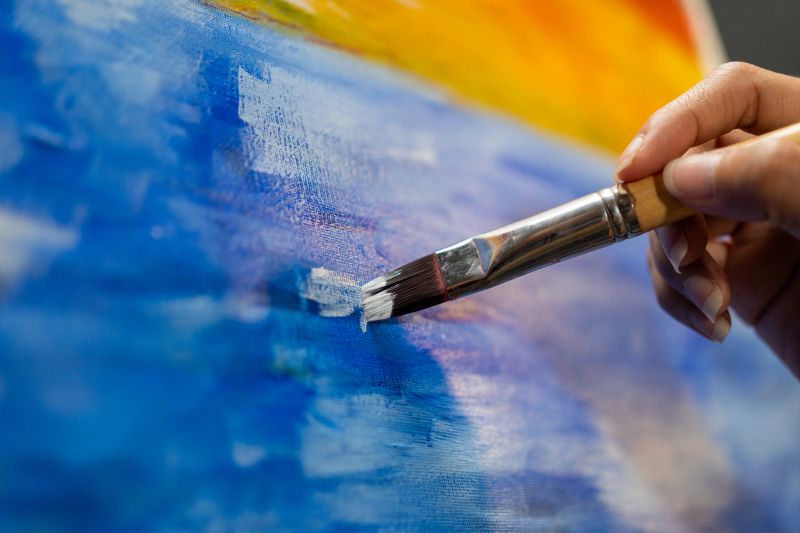 Abstract painting featuring vibrant colors and dynamic shapes, representing creativity and innovation.