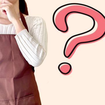 Person in apron with hand on chin and a large question mark beside them.