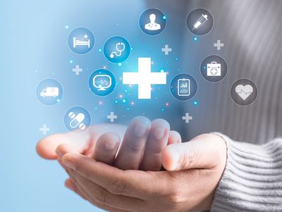 Folded hands holding digital benefits icons.