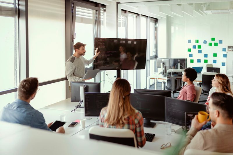 Man Leading Business Creative Team in Application Software Design Project. Brainstorm Meeting, Work Together, Internet Technology, Office Coworker, Teamwork Concept