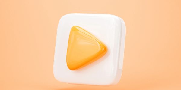 3D yellow play button icon on a white rounded square background.