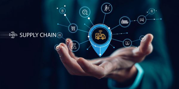 Businessman presenting digital supply chain network with icons and connections.