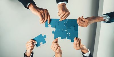 Jigsaw puzzle pieced together forming partners to the FEC. 