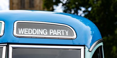 Blue vehicle with "Wedding Party" sign.
