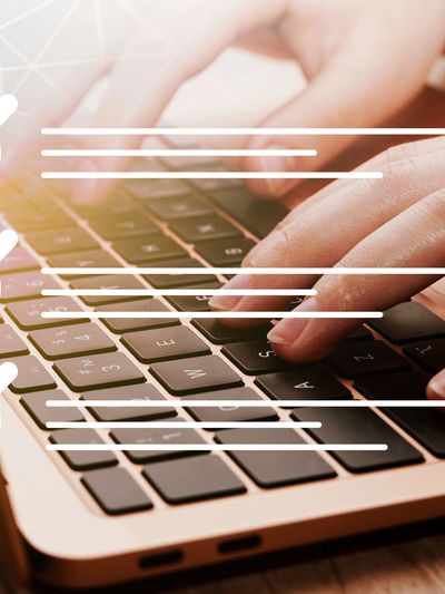 Hands typing on a laptop keyboard with checklist icons overlay.