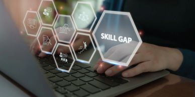 Image of hexagon shapes interconnected with the words "skill gap" prominent on the closest one