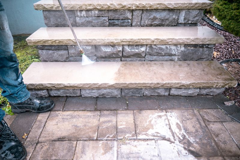 Before and after of high pressure water jet during cleaning dirty outdoor porch stairs.