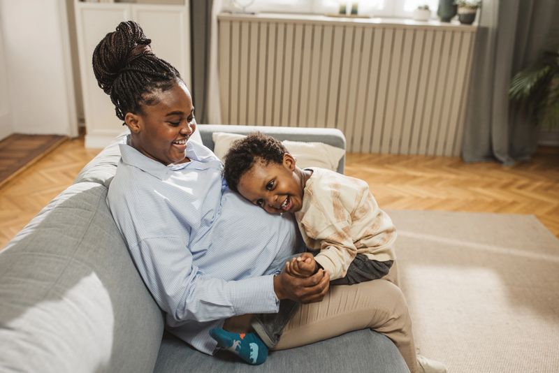 African mother holding the baby on her lap