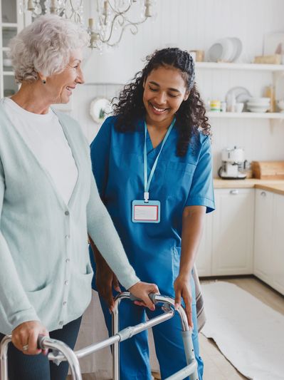 Nurse assisting senior woman with walker – in-home personal care services in Shelby, NC
