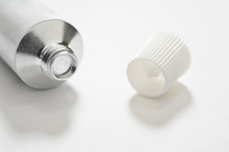 Lifehacks; The plastic cap of each tube has a spike in it used to break the foil/seal in the neck of the tube.