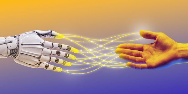 A robotic hand and a human hand connected by glowing yellow lines.