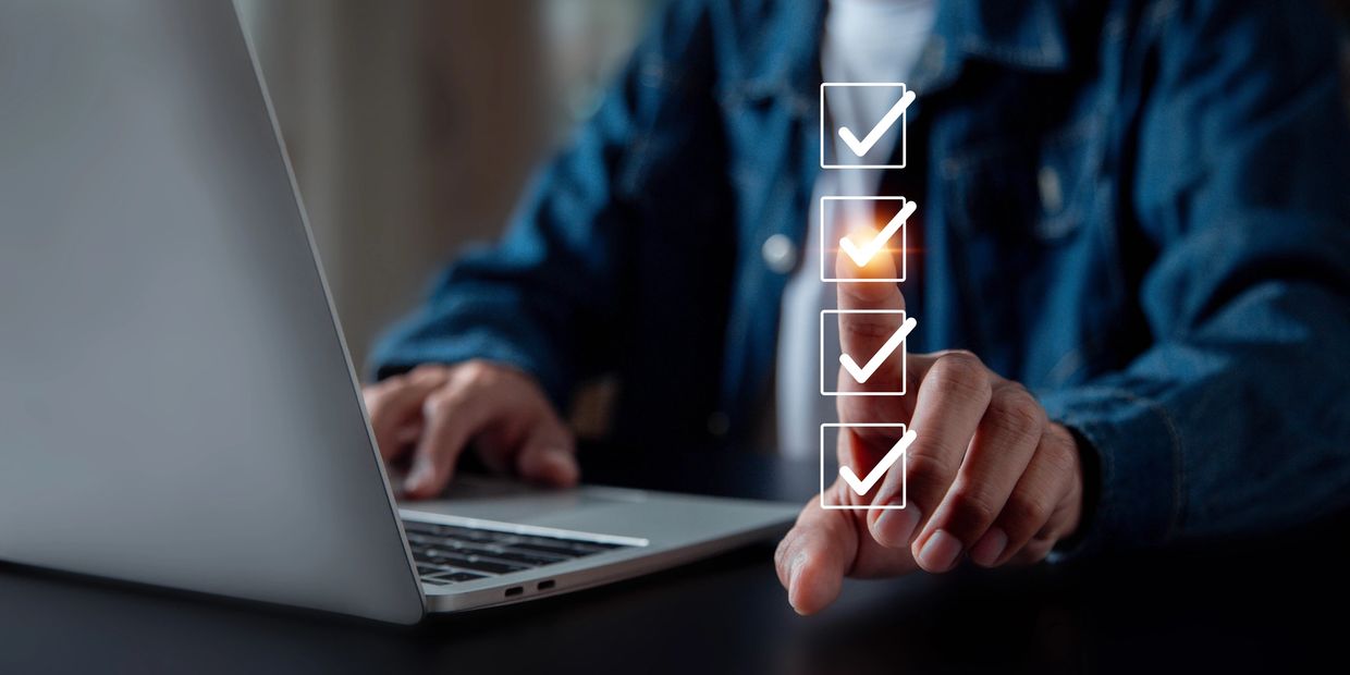 Person checking off items on a virtual checklist.