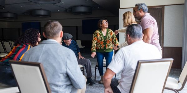A diverse group in a lively discussion in a casual circle.