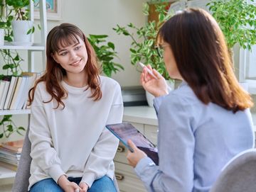 Woman receiving functional medicine care and hormone replacement therapy in Owasso at Pathway Health
