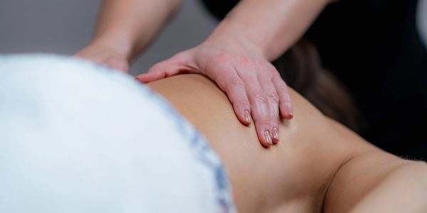 A person receiving a relaxing back massage.