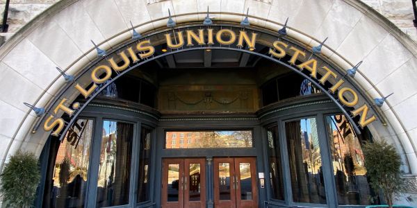 Entrance of St. Louis Union Station with arched sign.