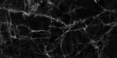 Black marble texture with white veins creating a striking pattern.