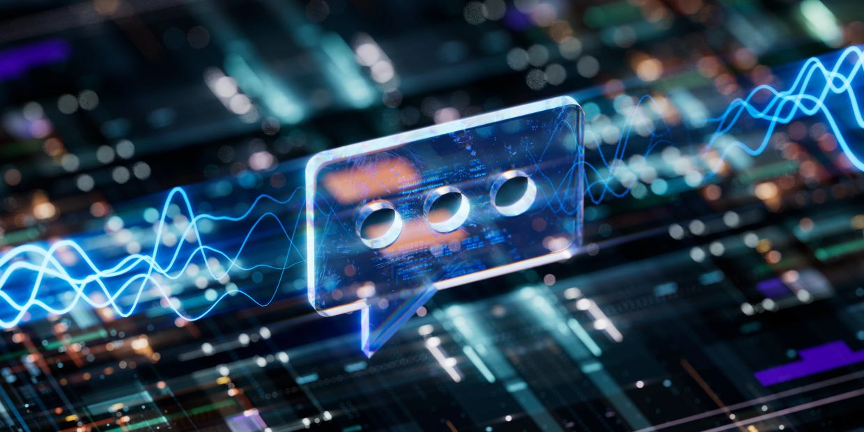 Glowing digital chat bubble with audio waves in futuristic setting.