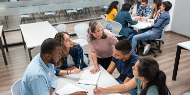 A group of students collaborating on a project in a classroom.
