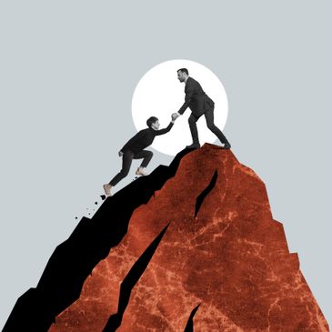 Man helping another climb a steep rocky mountain with full moon backdrop.