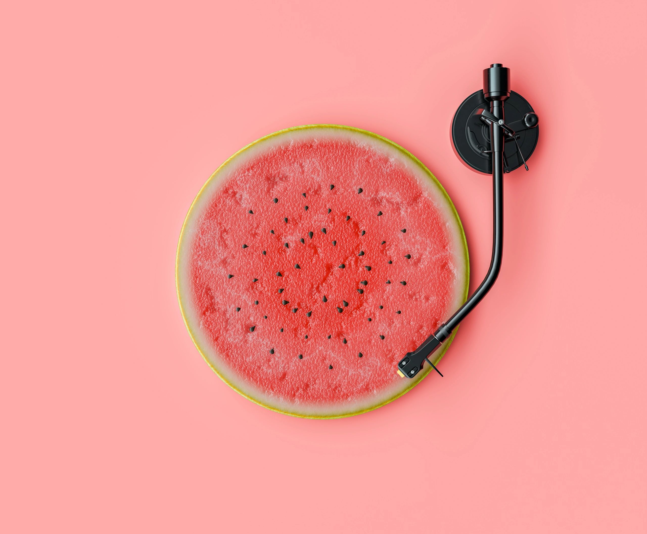 A watermelon slice as a record on a turntable.