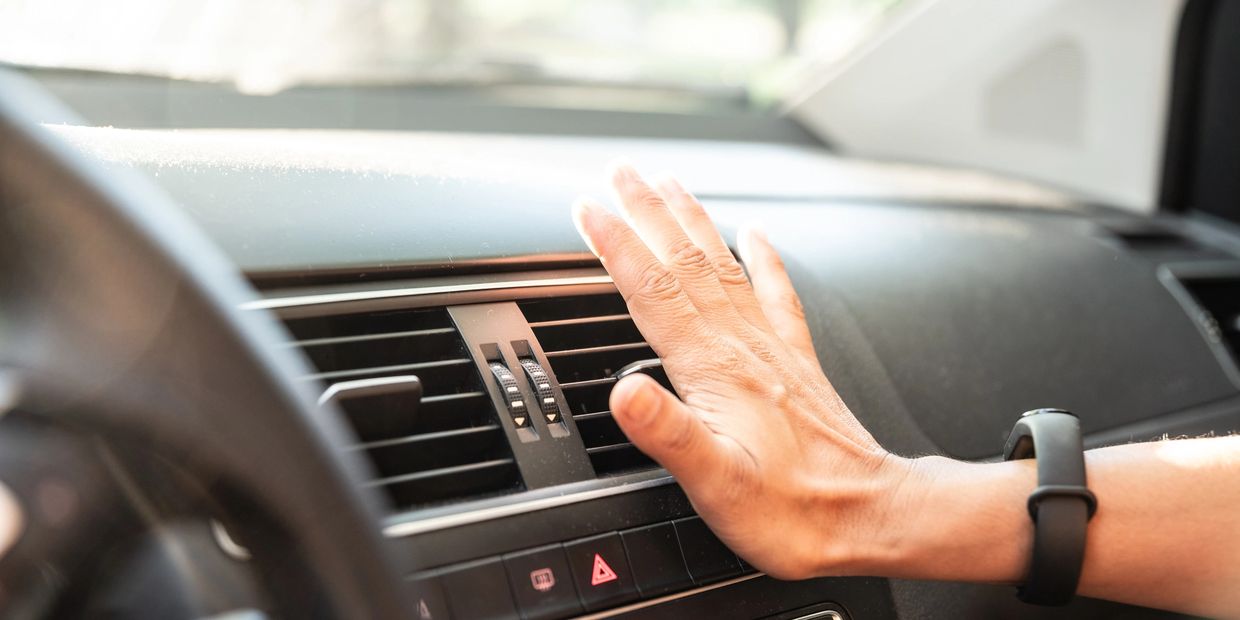 ac temperature being felt by a persons hand at st george auto gallery service 