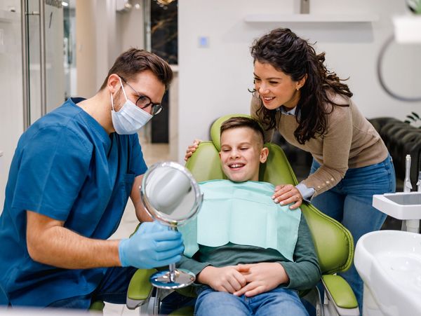 A dentist provides cosmetic dentistry to a child near Webster County, KY.