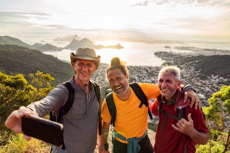 Senior friends taking a selfie after a successful hike
