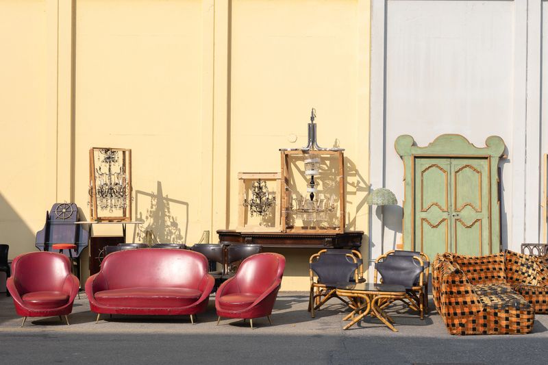 Antique Wooden Stuffed - Furniture, Cabinets, Sofas, Chairs and Mirrors Leaning Outside on the Street.