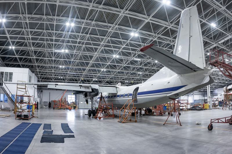 Transport turboprop airplane in the aviation hangar