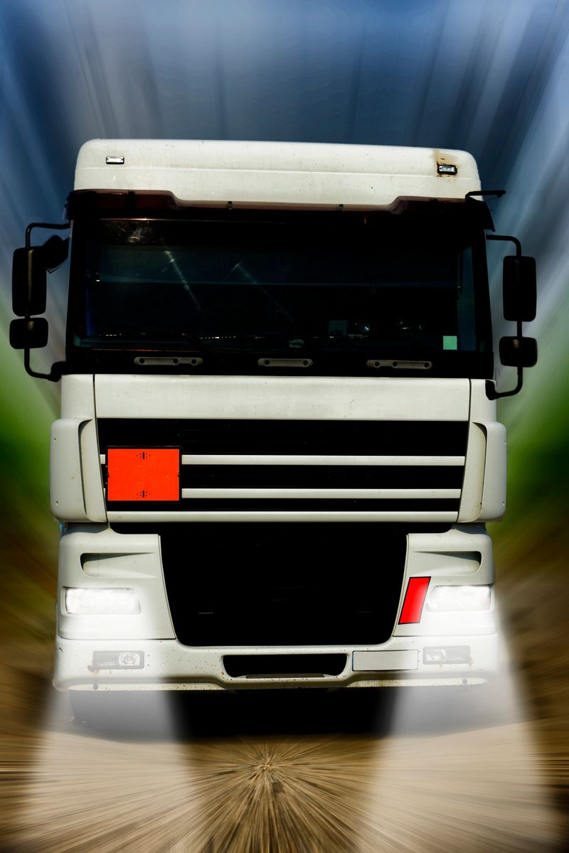 Truck travelling in the night on highway
