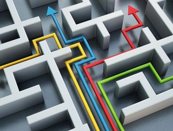 Colorful arrows navigating through a maze.