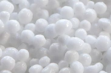 White urea (carbamide) fertiliser granules close-up
