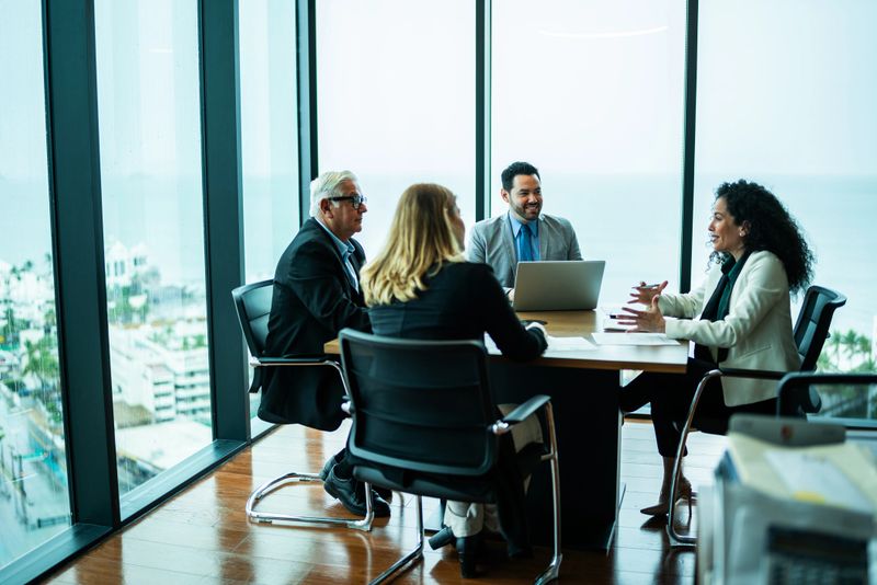 Coworkers talking on business meeting on office