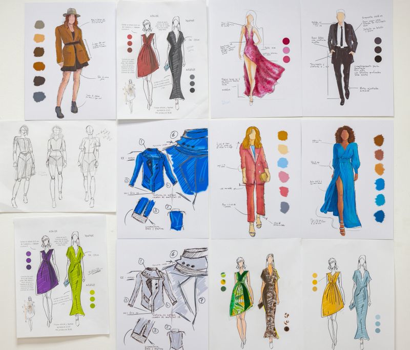 Beautiful fashion sketches on the wall at an atelier - fashion concepts