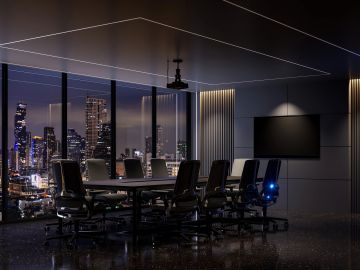 Modern conference room with city night view.