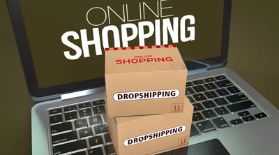 online dropshipping image with laptopn and parcel sat ontop