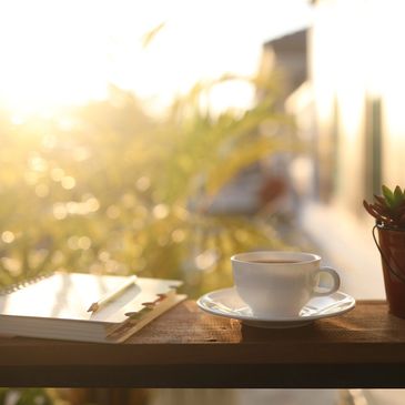 Morning Sunrise with a cup of coffee and a planner.