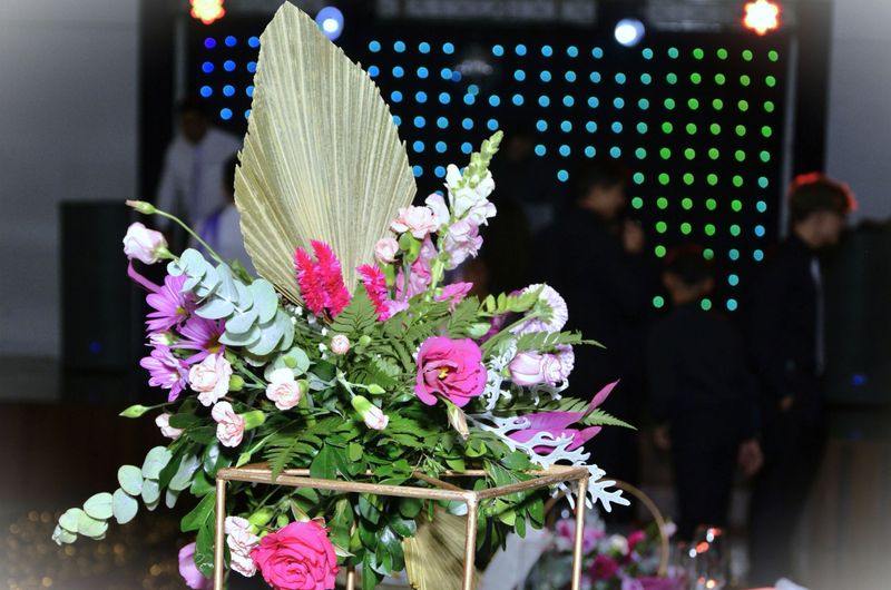 In the party room, a beautiful arrangement of various flowers decorates the party space