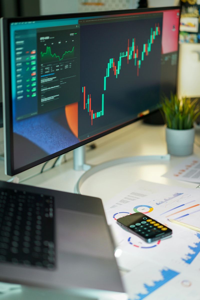 Screen with financial charts. Stock quotes. Currency and cryptocurrency exchange. Calculator on documents.