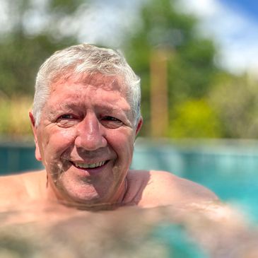 happy man swimming in pool