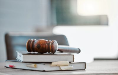 Wooden gavel on law books.