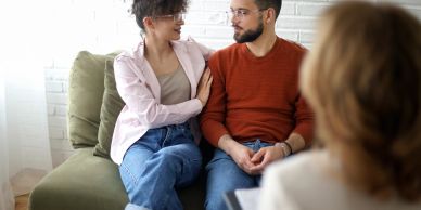 Couple talking to a therapist in a session.