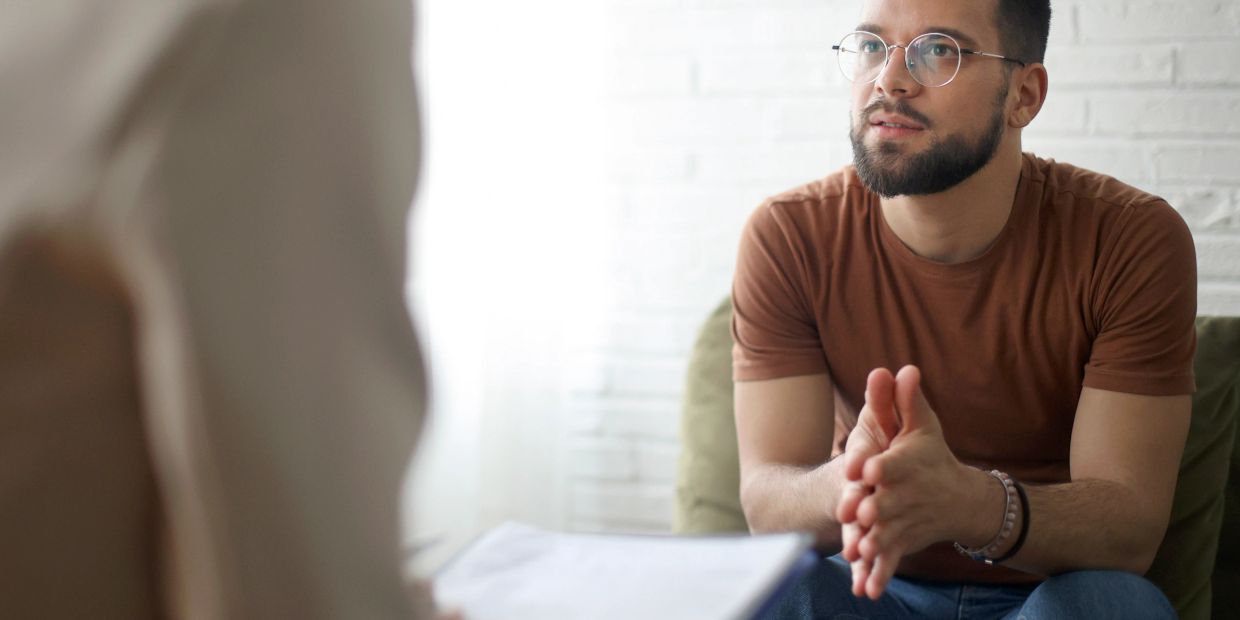 Man attentively listening during a conversation.