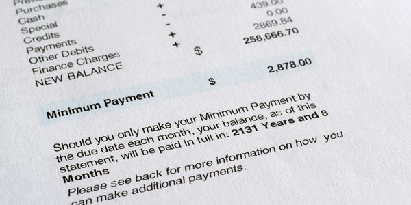 Credit card statement showing a high balance and long repayment period.