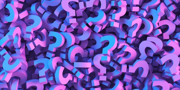 3D blue and pink question marks piled together.