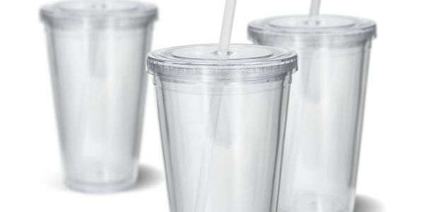 Three clear plastic tumblers with lids and straws.