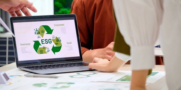 Laptop screen showing ESG environmental, social, and governance concepts.